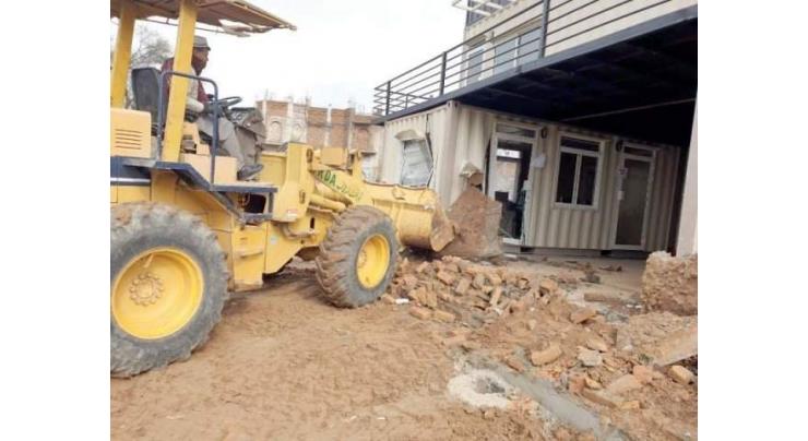 Rawalpindi Development Authority demolishes two fences, seals 6 shops, 4 site offices of illegal housing schemes
