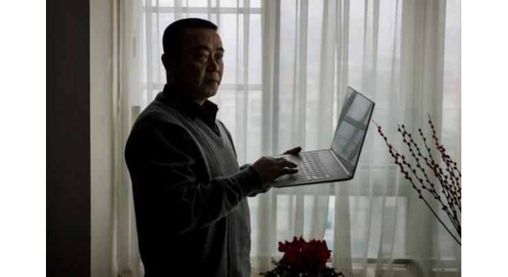China's first 'cyber-dissident' given 12-year jail term: court
