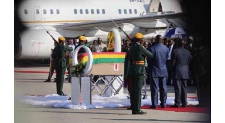 Mugabe's body arrives home for burial in divided Zimbabwe
