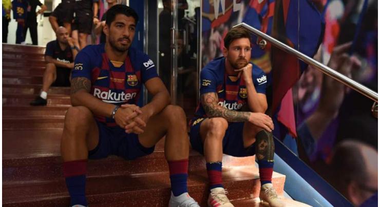 Messi still out but Barcelona could welcome back Suarez
