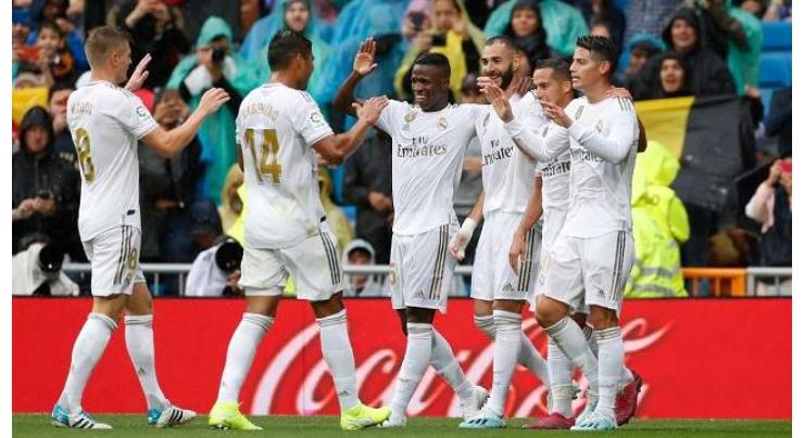 Real Madrid hang on for win after Benzema brilliance

