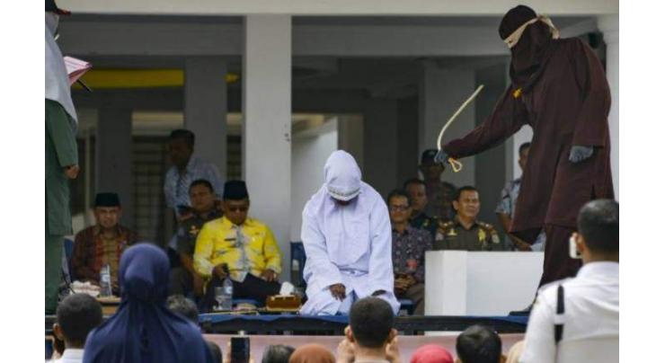 Couples flogged for public affection in Indonesia's Aceh
