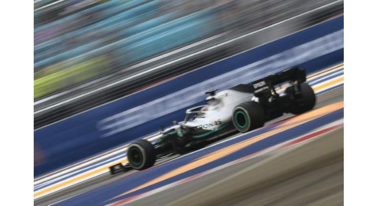 Hamilton shocked by Ferrari pace as Leclerc takes Singapore pole
