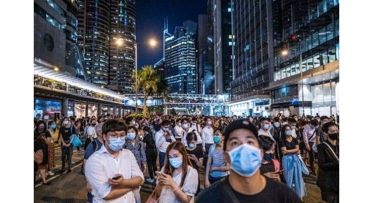 Clashes in Hong Kong as face masks banned under rare emergency powers
