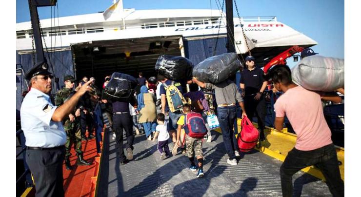 Three hurt as asylum-seekers clash on Greek island
