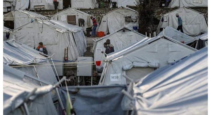 Three hurt as asylum-seekers clash on Greek island
