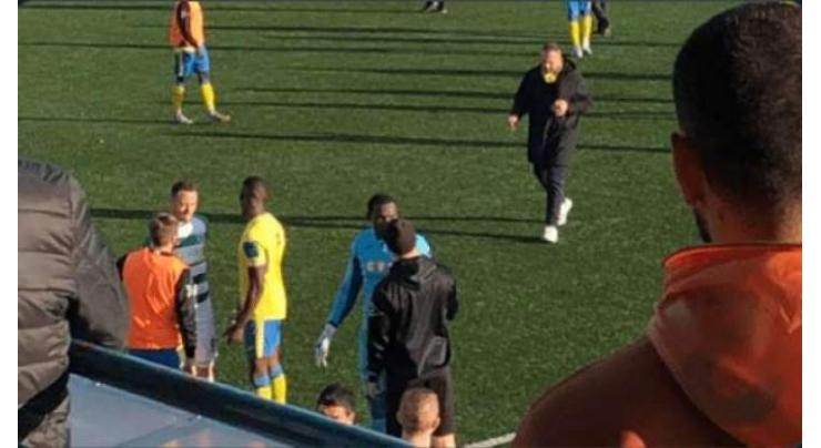 Two arrested over racism that forced FA Cup match abandonment
