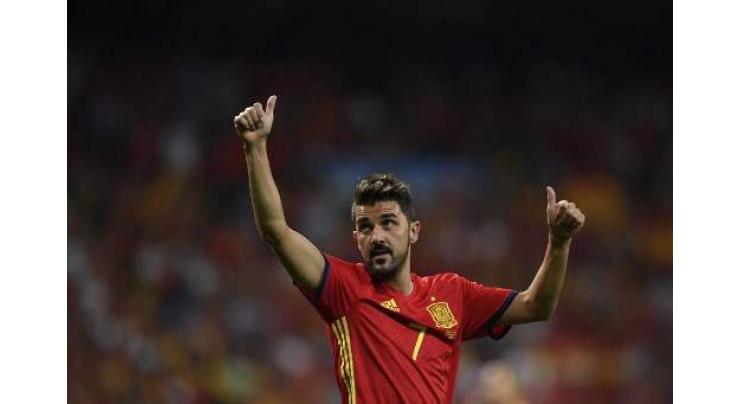 Spain's record scorer striker Villa retires after 19-year career

