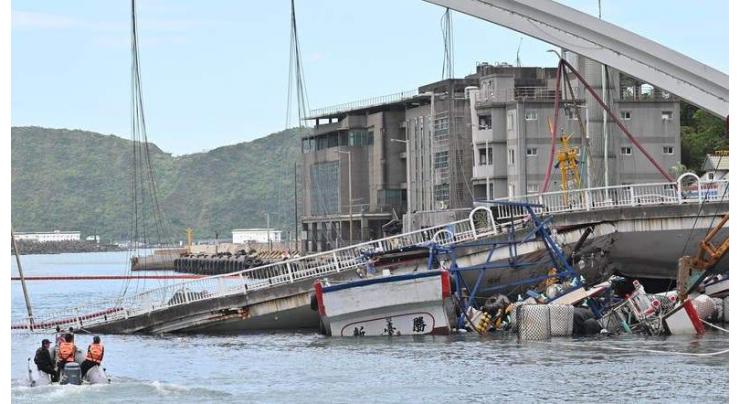 Car, truck swept away in French bridge collapse
