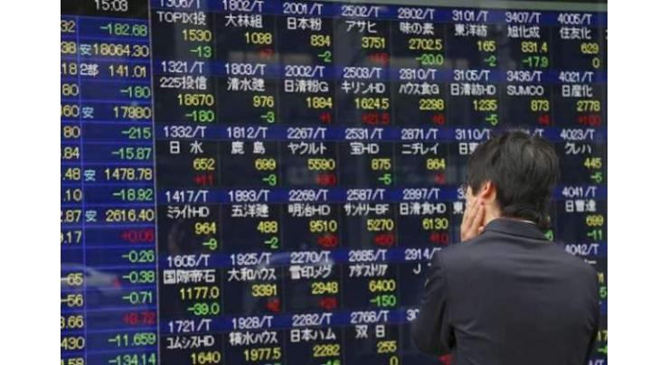 Tokyo stocks close lower on fresh trade worries
