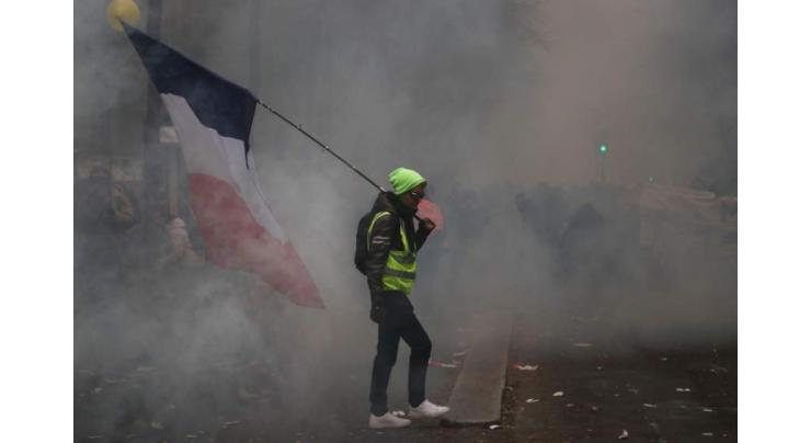 Paris police use tear gas to disperse rioters at strike protest
