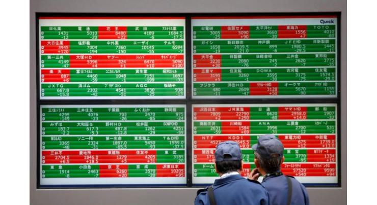 Tokyo stocks edge down in cautious trade
