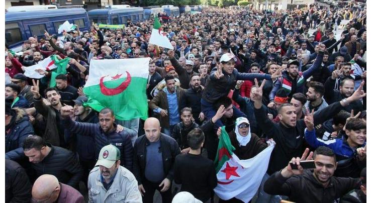 Algerians mass in capital in protest at new president
