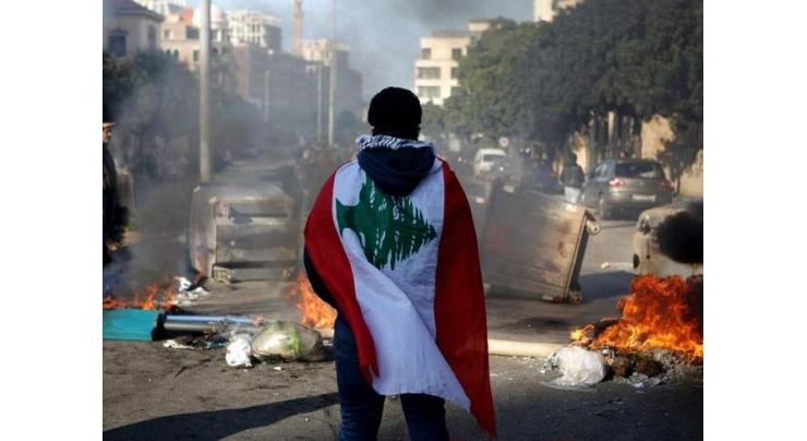 Lebanese block roads as protests enter fourth month
