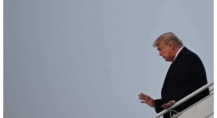Trump arrives in Davos hours before impeachment trial reopens
