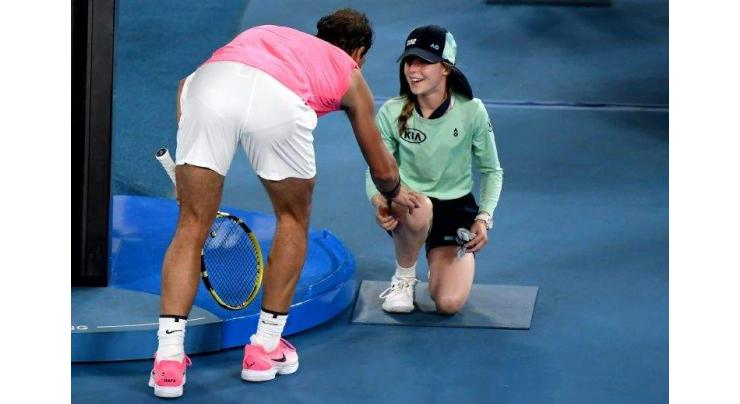 Nadal shows caring side with kiss for blushing ballgirl
