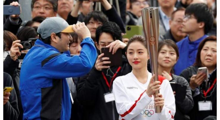 Tokyo holds Olympic torch rehearsal as spectre of virus looms

