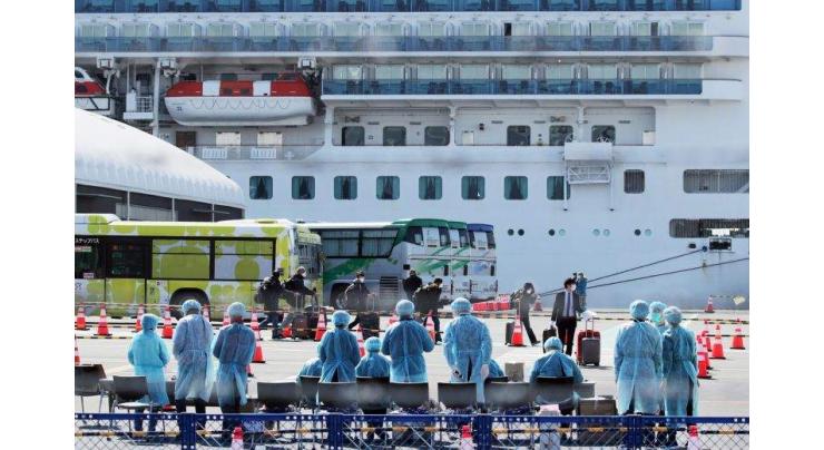 Crew leaves Japan virus-hit ship for new quarantine
