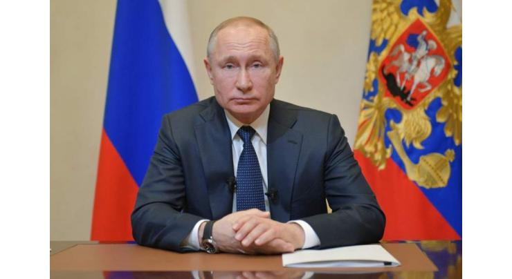 Putin delays reforms vote, holds back on tough virus measures
