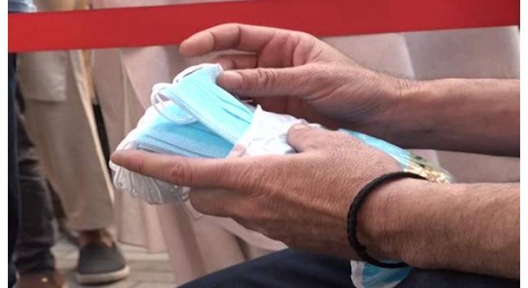 TMO Chitral distributes free masks, gloves, sanitizers
