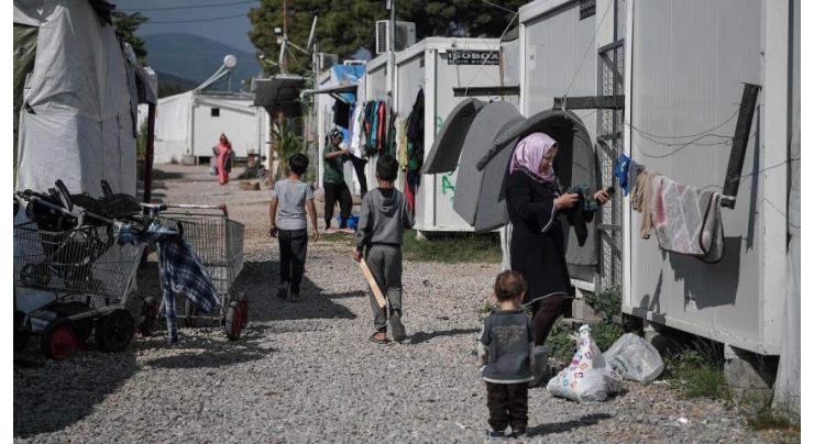 Greece seals off virus-hit migrant camp
