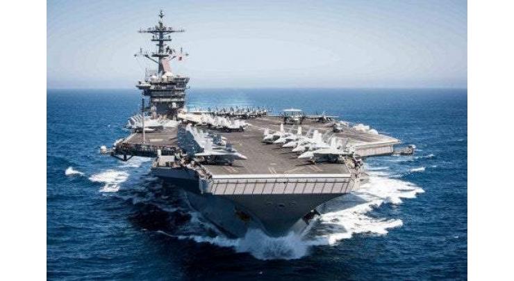Pentagon removes captain of virus-struck aircraft carrier

