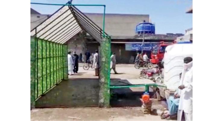 Another sanitizer walkthrough gate installed at Faisalabad market
