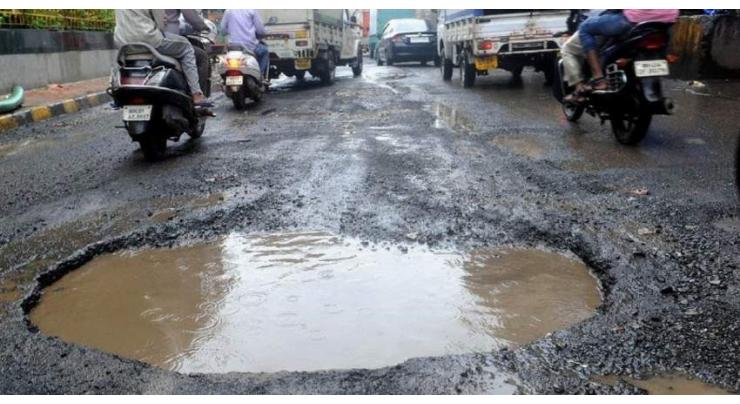 Rain-water filled deep potholes at Kahuta road make traffic movement miserable
