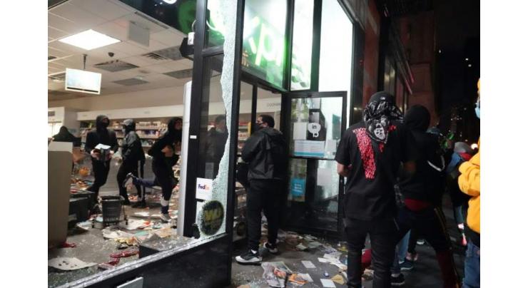 New York under curfew as looters hit luxury stores

