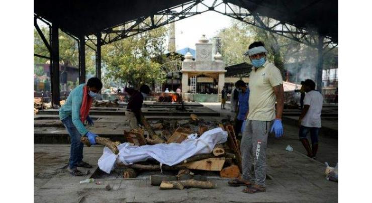 Open all hours, New Delhi crematorium struggles with virus dead
