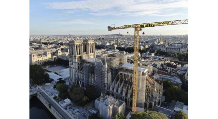 Greenpeace Activists Hang Climate Change Banner Over Notre Dame to Protest Gov't Inaction