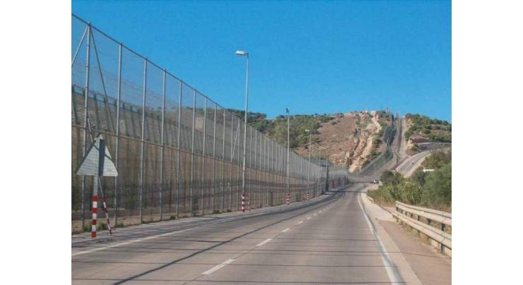 Migrant dies in mass border crossing into Spanish enclave
