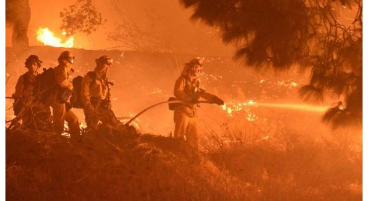 California fires force thousands to flee as governor asks for help
