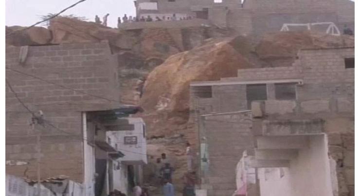Woman dies, girl injured as boulder falls on house
