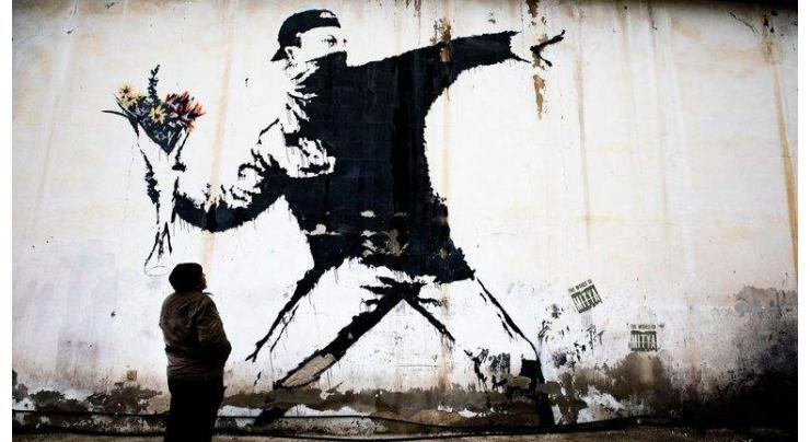 Banksy loses trademark case over the 'Flower Thrower'
