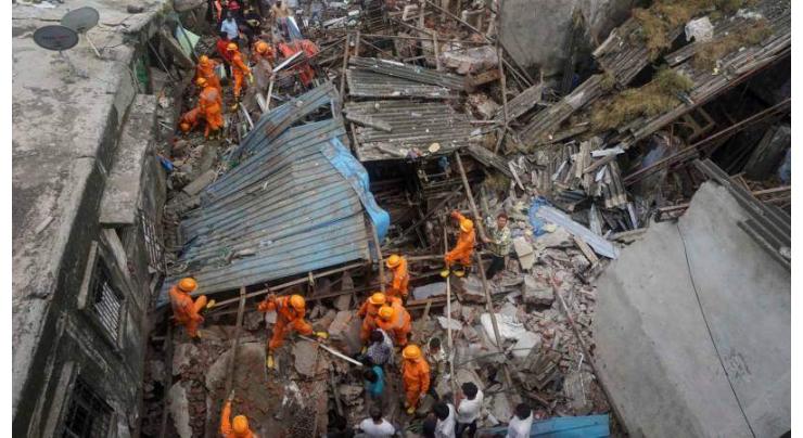 Rescuers find five alive, over 30 hours after India building collapse
