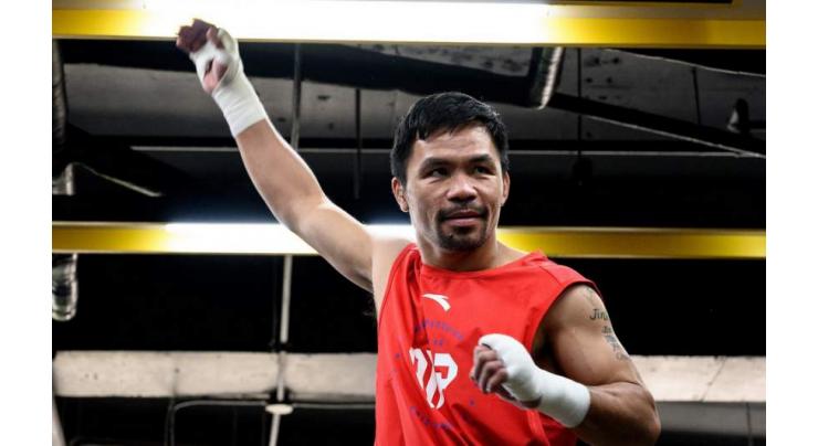 Pacquiao wants McGregor fight next year: statement
