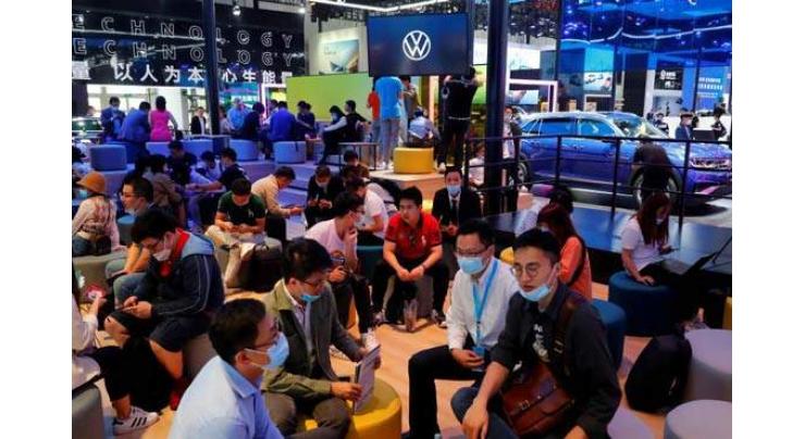 Crowds in masks pack out China auto show after virus delay
