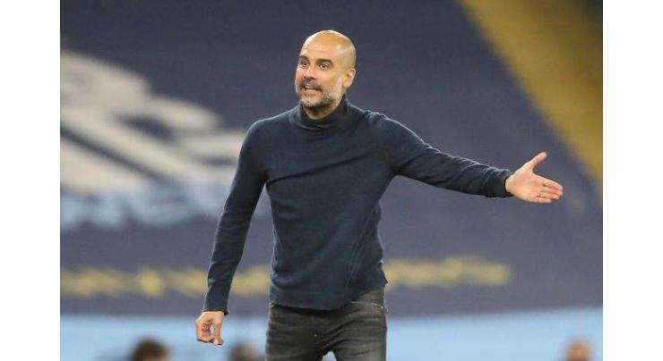 Guardiola fears 'crazy' schedule will take toll on players
