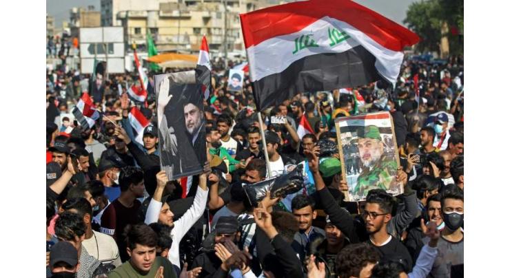 Three dead as rival protesters clash in southern Iraq
