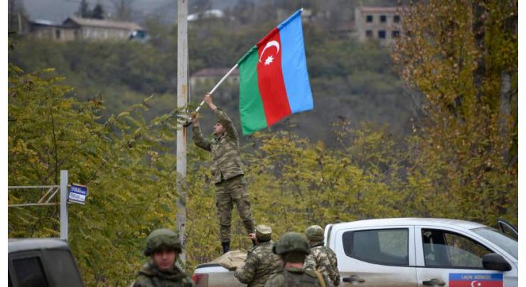 Azerbaijani forces raise flag in last district handed back by Armenia
