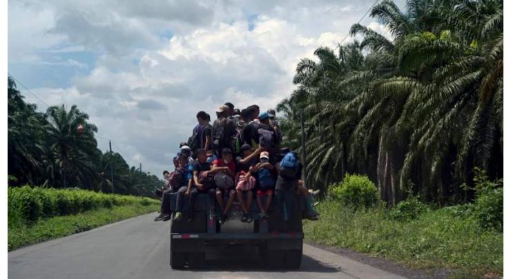 Thousands of US-bound Honduran migrants cross border into Guatemala

