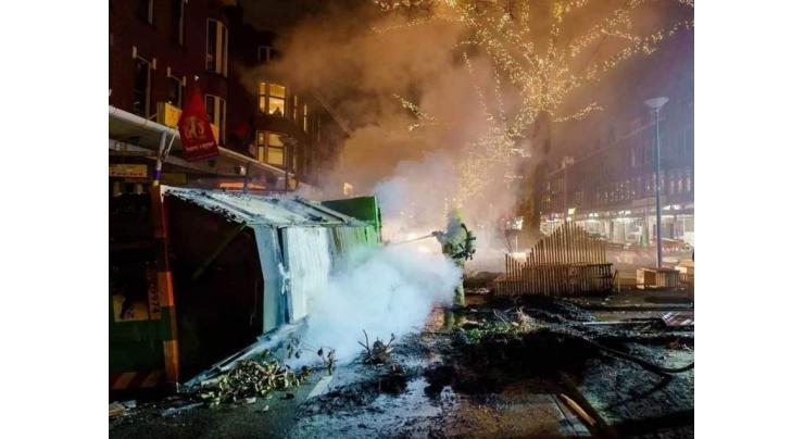 Dutch police arrest nearly 200 in new curfew riots
