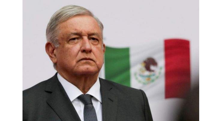 Mexico leader urges Biden to give migrants work visas
