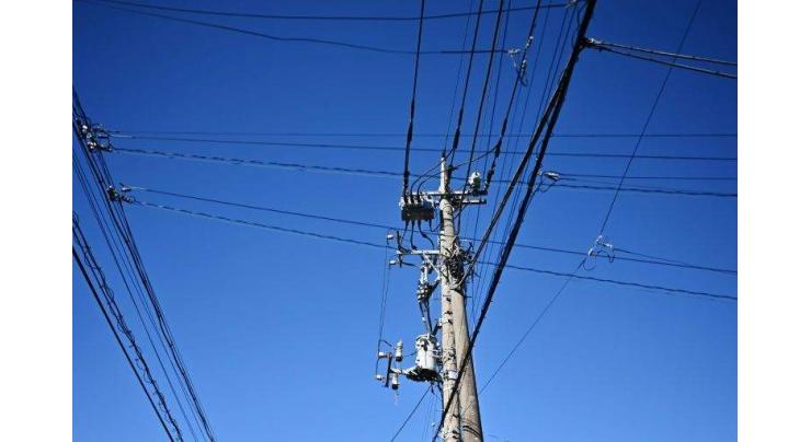 Chinese man causes outage after sit-ups atop power pole: reports
