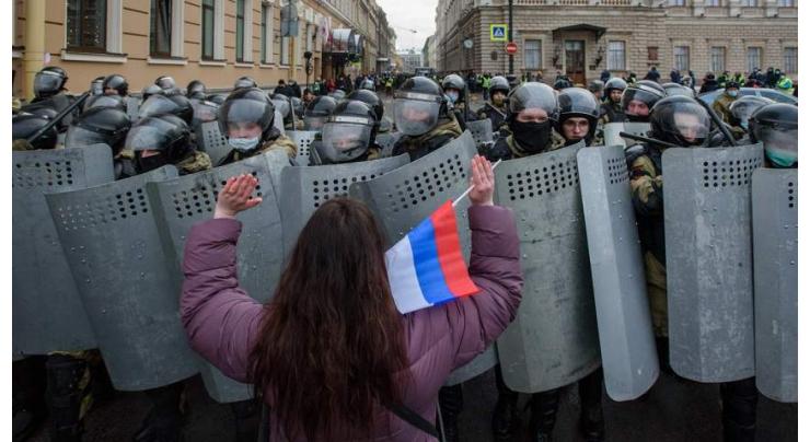 Russia tightens fines for opposition protesters, social media
