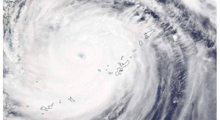 One dead as powerful typhoon brushes past the Philippines
