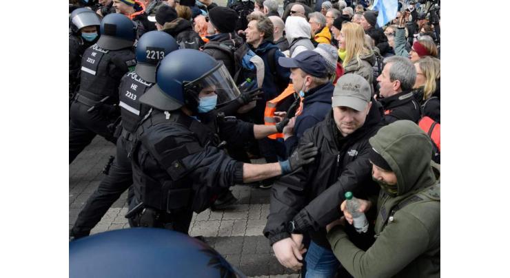 Police clash with protesters as Germany passes virus law
