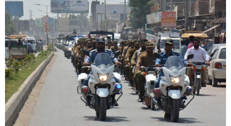 Police carry out flag march in provincial capital

