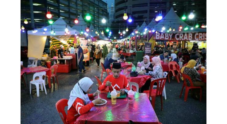 Malaysia tightens curbs in capital as virus cases climb
